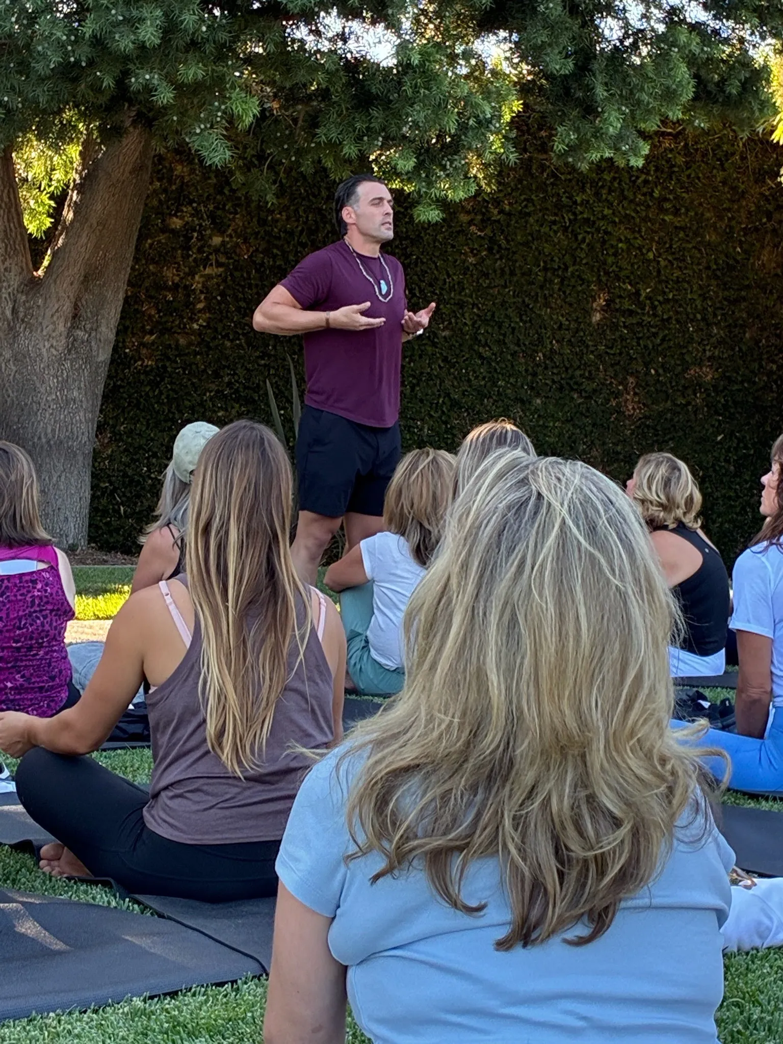 Dominic Luke speaking to an outdoor workshop group